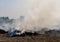 Dense dust and smoke from burning stubble in post-harvest agricultural areas