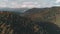 Dense forests of green and brown colour cover hills