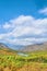 Dense forests and lake among hills and highland.