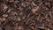 Dense Textured Wood Mulch With Smokey Background - Charcoal Brown