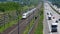 Dense traffic on autobahn A3 and passing ICE highspeed train