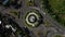 Dense traffic roundabout top down rotating aerial