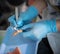 dental assistant cleaning dentures