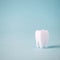 Dental care concept, Healthy tooth model on blue background with copy space. Minimal dentistry, oral tooth hygiene concept