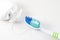 Dental care. Toothbrush and dental floss on white background. Close up