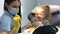 dental chair doctor in mask with yellow gloves with tool for dental treatment who tries on sunglasses doctor waits for