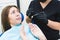 Dental clinic. Reception, examination of the patient. Teeth care. Young woman feels fear at the dentist