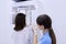 Dental diagnostic examination, dental x-ray equipment, nurse with woman patient