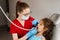 Dental drill. Child dentist drilling teeth of kid girl in dentistry clinic. Dental filling for child patient.