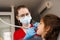 Dental drill. Child dentist drilling teeth of kid girl in dentistry clinic. Dental filling for child patient.