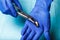 Dental and endodontic instruments in hands. Top view