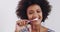 Dental, face and black woman brushing teeth in bathroom for breath, wellness and hygiene. Oral care, toothbrush and