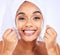 Dental floss, teeth and face of a woman for health and wellness in studio. Portrait of a young female model flossing