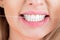 Dental flush - woman flossing teeth. Dental floss. Taking care of teeth. Healthy teeth concept. Teeths Flossing. Oral
