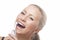 Dental Health: Blond Caucasian Woman Brushing Her Teeth with Electric Toothbrush