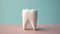 Dental Health: Single Tooth Model on a Plain Black Surface Close-up