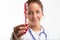 Dental nurse, dentist or hygienist holding up a red toothbrush