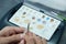 Dental technician adds glaze and shading to a set of fake teeth, at the laboratory. Aesthetic coloring of teeth