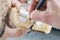 Dental technician applying ceramics to teeth in the dental model