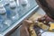 Dental technician applying ceramics to teeth in the dental model