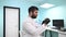 Dental technician holding a cast of the jaw in his hands.