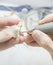 Dental technician making tooth prosthetic in laboratory close up