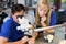 Dental technicians working on microscope