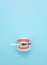 Dental Teeth Model dentures holds dentist Disposable plastic syringe. Healthy equipment tools dental care. Dentistry conceptual