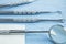 Dental Tools and Gauze on a Paper Lined Tray