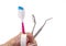 Dental tools with toothbrush interdental pick and floss.