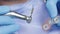 Dental tooth implantation. Dental surgeon removes the body of the implant from its sterile case. Dental surgery