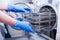 Dentist assistant`s hands get out sterilizing medical instruments from autoclave. Selective focus