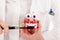 Dentist with brush and denture showing ho to do