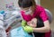 Dentist cleaning teeth of woman