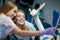 Dentist curing a woman patient