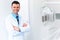 Dentist Doctor Portrait. Young Man at His Workplace. Dental Clin