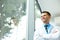 Dentist Doctor Stands Near Window and Thinks about Clinic Future