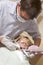 Dentist in exam room with young boy in chair