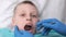 The dentist examines the child. Dentistry in children. The orthodontist examines the oral cavity of the boy. Sharp