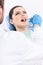 Dentist examines the oral cavity of the patient