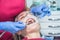 A dentist examines a patient, close-up of a patient with an open mouth next to which dental objects. The concept of