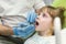 Dentist examining little girl`s teeth in clinic. Dental problem.