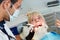 Dentist examining patient