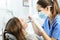 Dentist examining patient teeth at office