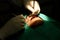 Dentist examining a patients teeth in the dentists chair under bright light at the dental clinic