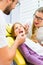 Dentist giving girl treatment