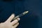 Dentist hand in glove holding syringe anesthesia. Close up of doctor holding syringe with dental anesthetic. Medicine