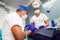 Dentist and his assistant doing a thorough examination of a patient