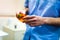 Dentist holding a dental curing lamp closeup