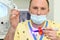 Dentist holds ultraviolet curing light tool